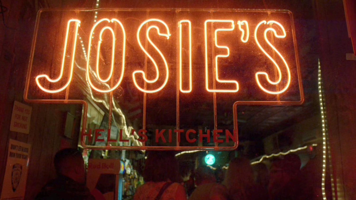 Neon sign in the window of Josie's Bar, Hells Kitchen.