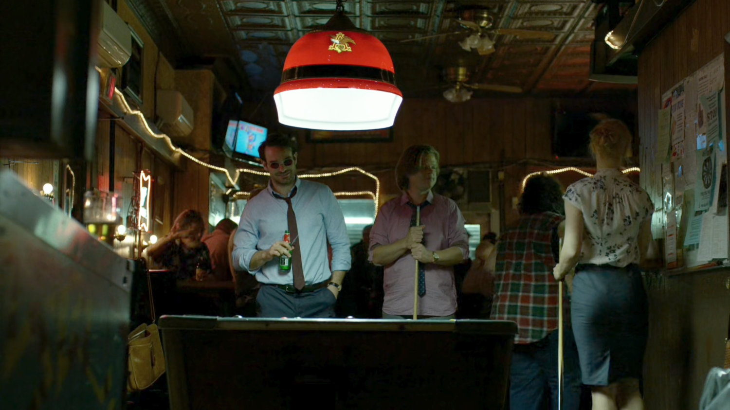 Matt, Foggy, and Karen around a pool table at Josie's Bar.