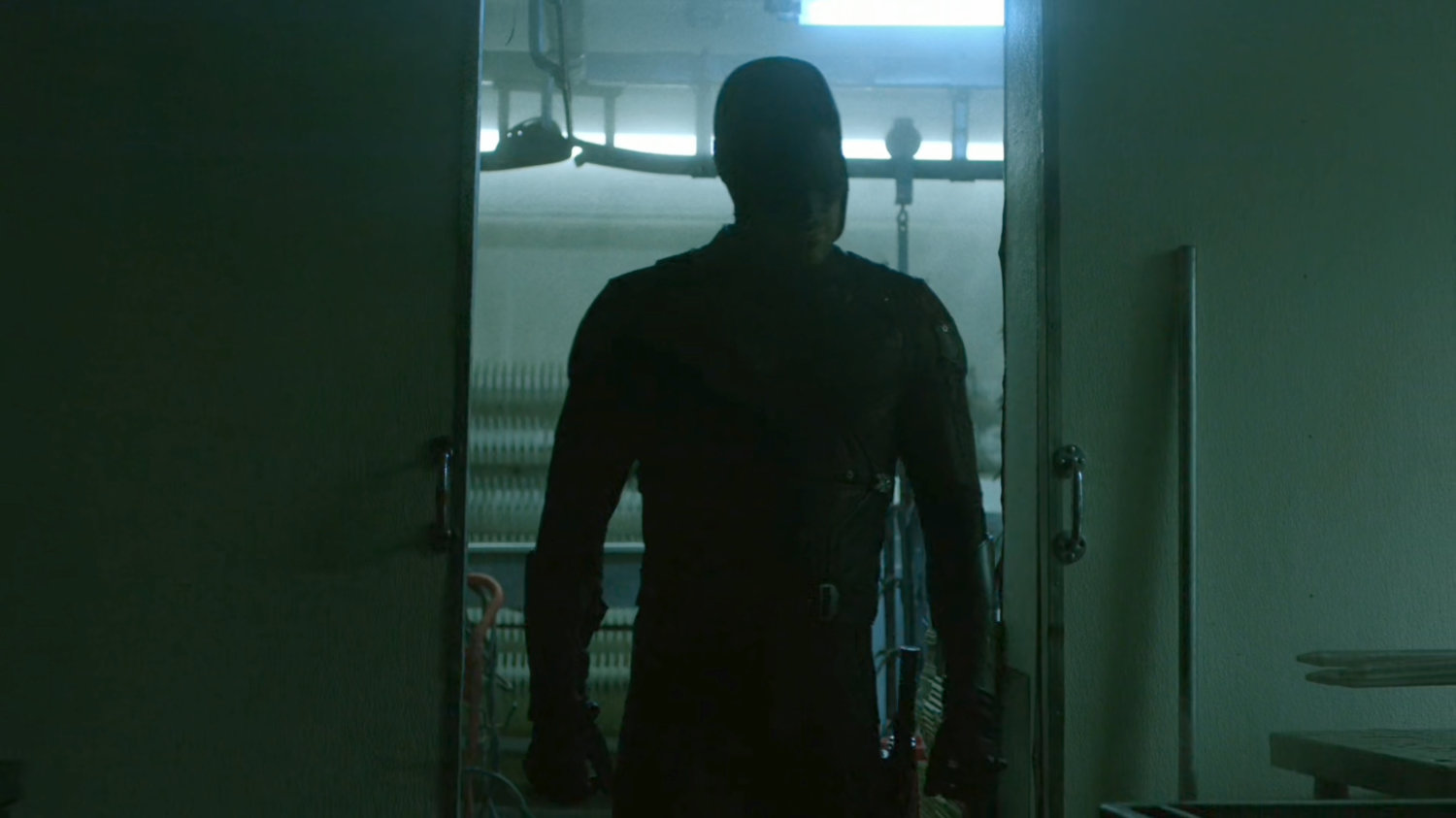 Daredevil investigating a meat packing plant freezer.