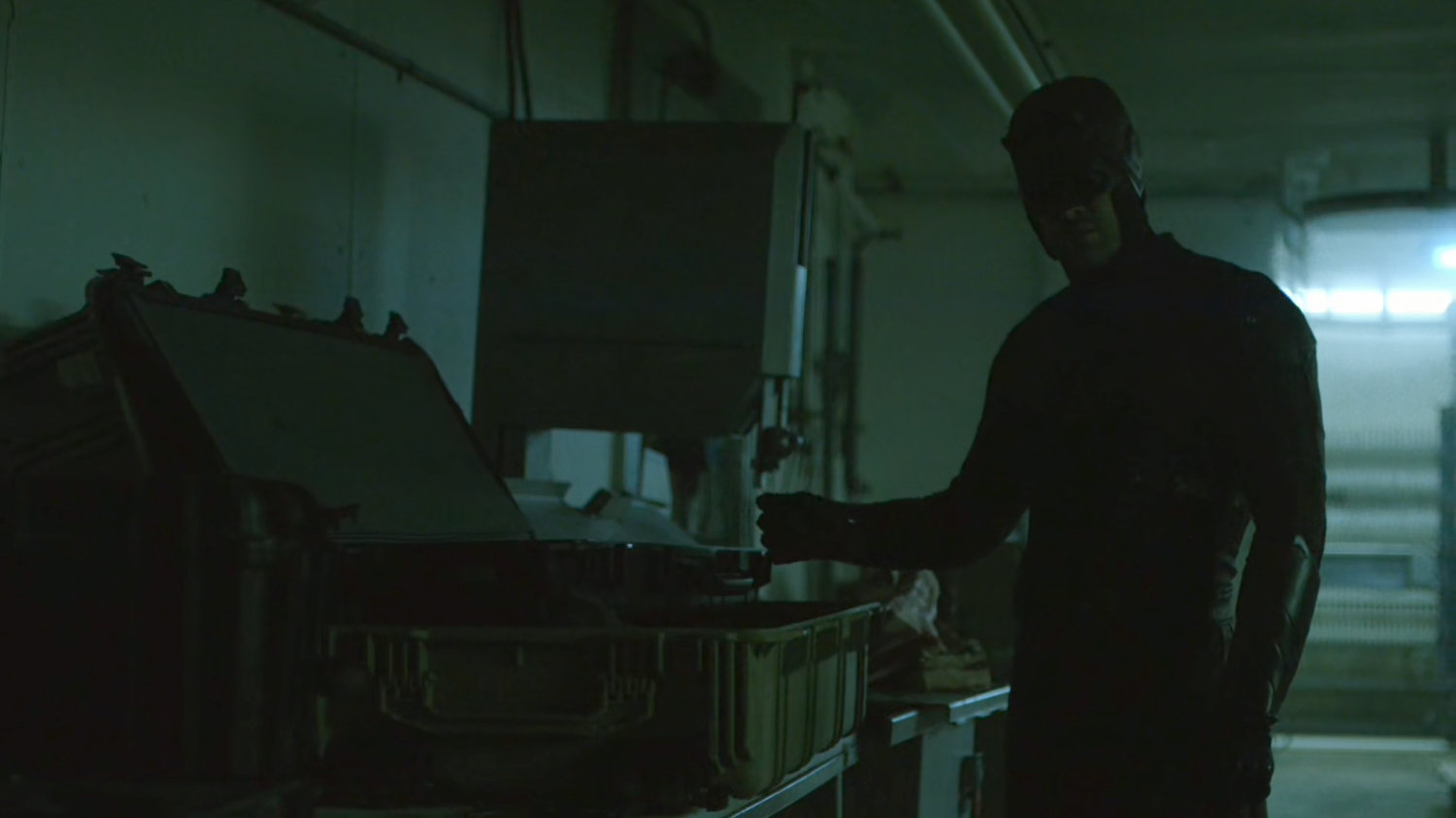 Daredevil investigating a meat packing plant freezer.