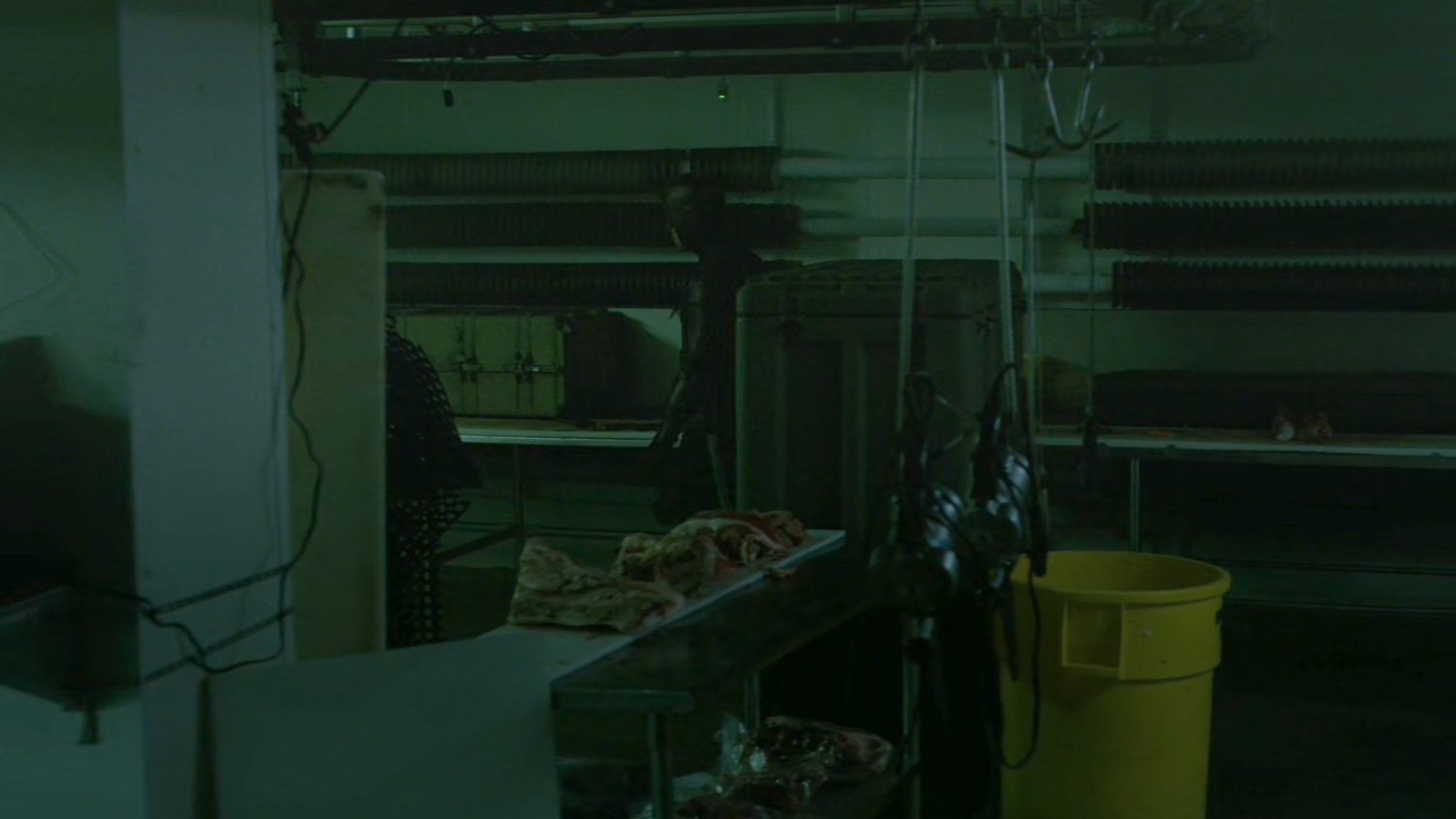 Daredevil investigating a meat packing plant freezer.