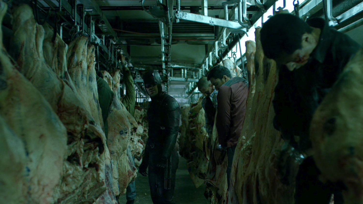 Daredevil investigating a meat packing plant freezer.