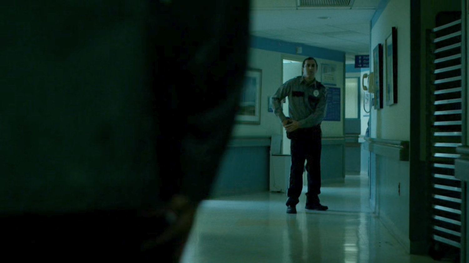 A police officer see The Punisher approaching in a Metro-General hallway.