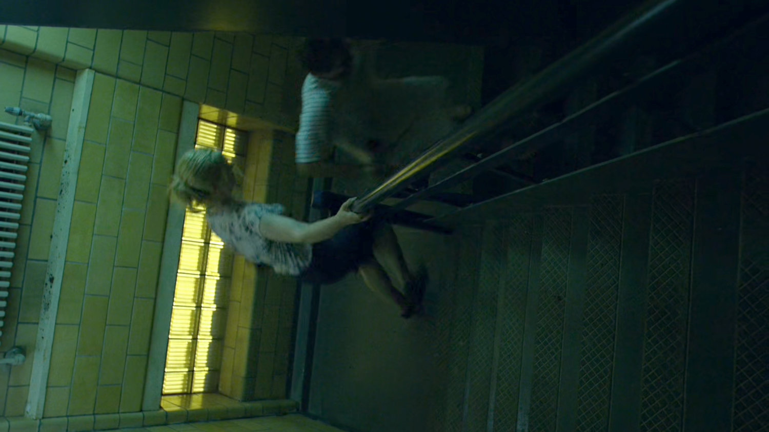 Grotto and Karen flee down a Metro-General stairway.
