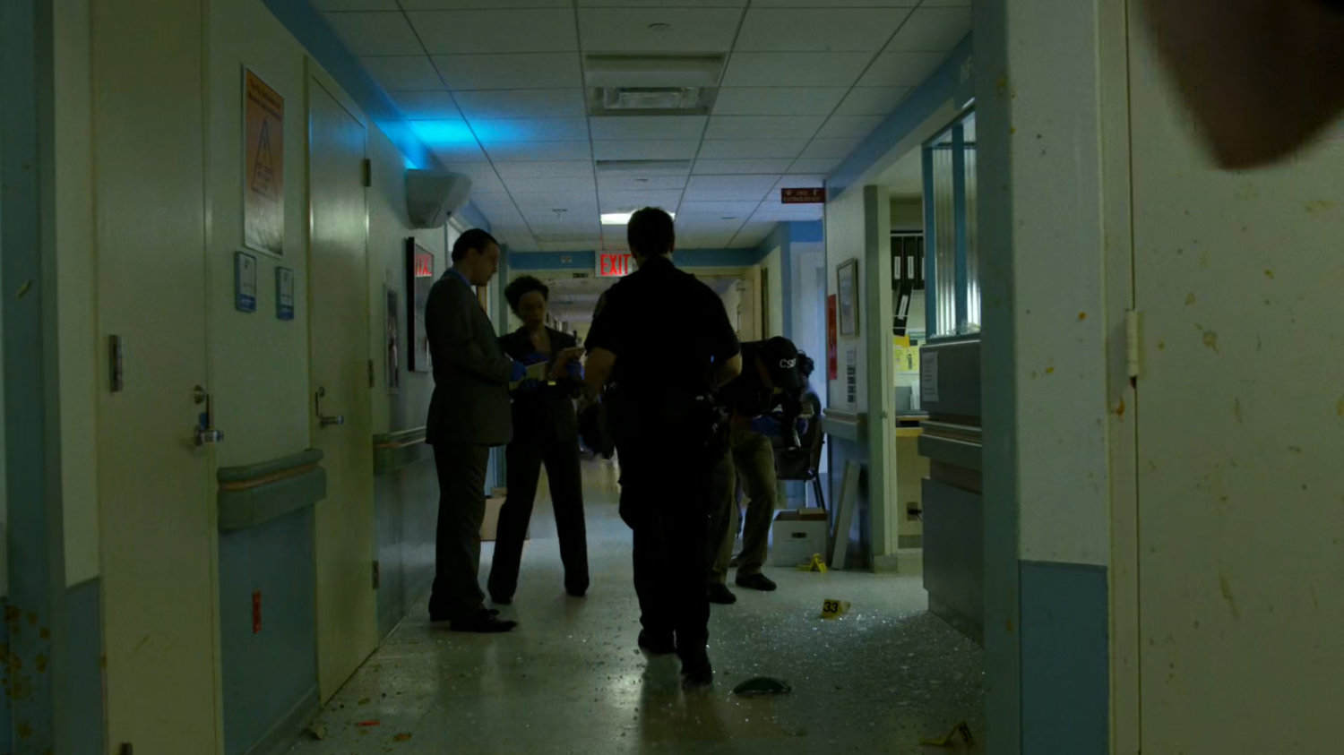 Police in a Metro-General hallway.