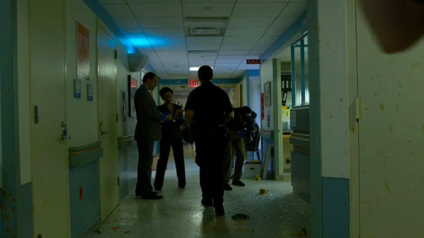 Police in a Metro-General hallway.