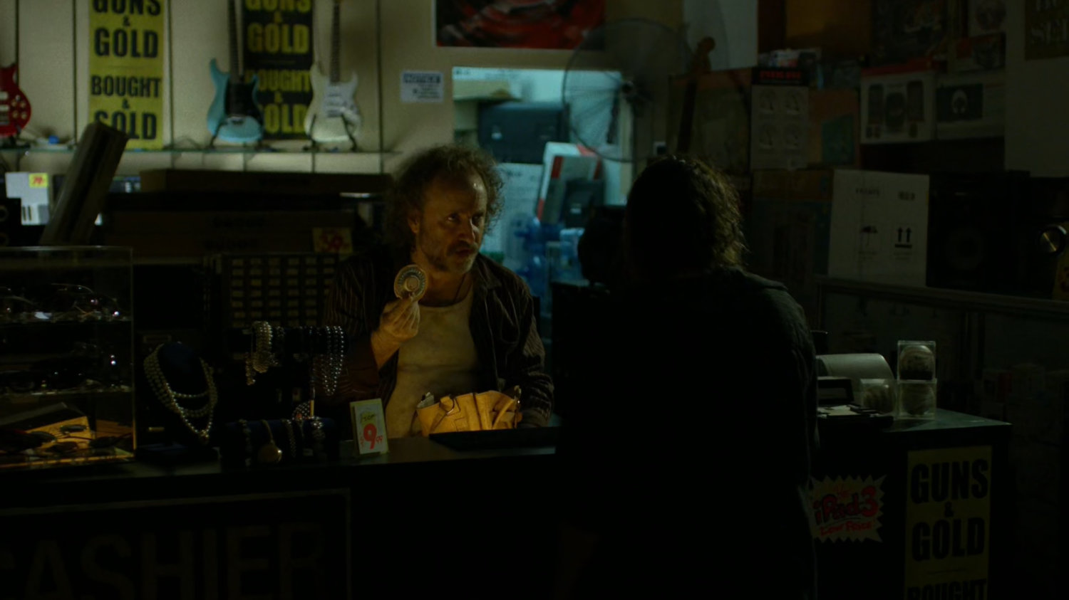 Pawn shop owner and a customer.