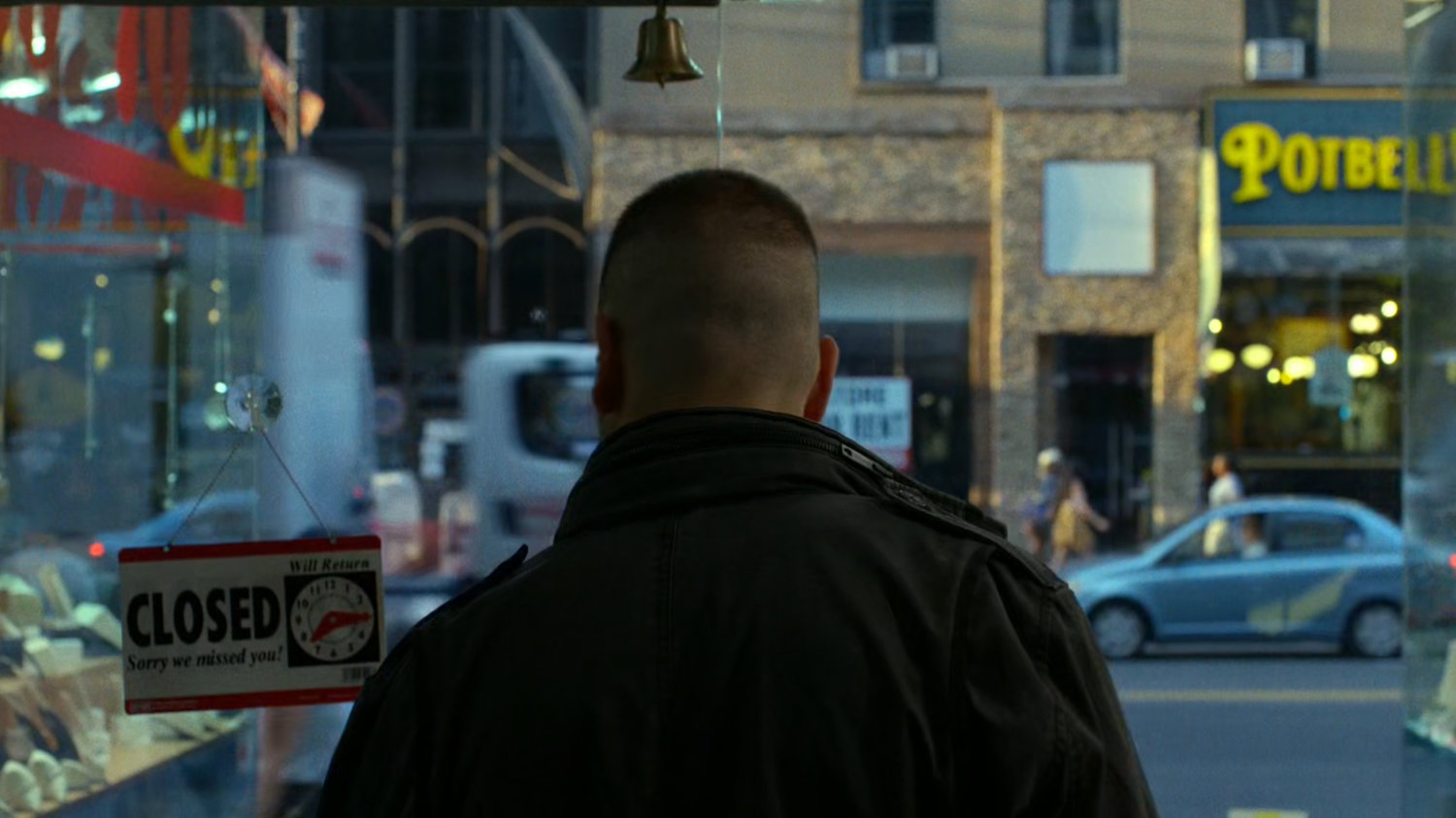 Frank Castle locks the entrance to the pawn shop.