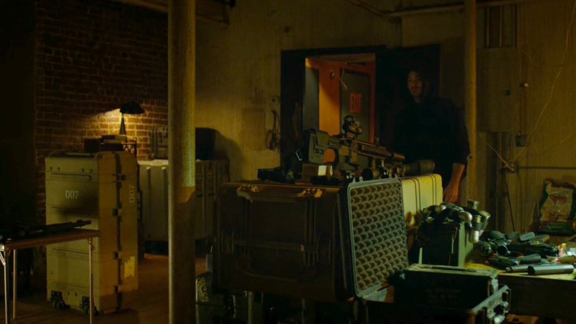 Matt looking at guns in Interior of Frank Castle's apartment.
