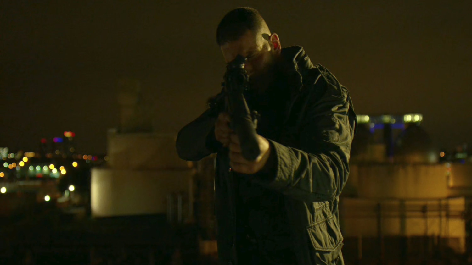 The Punisher atop a water tower aiming gun at police.