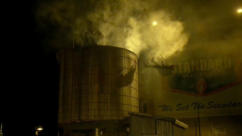 Daredevil kicking Punisher off water tower.