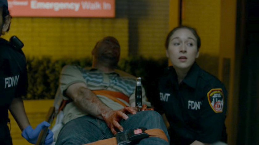 Man with knife in thigh being brought into Metro-General emergency room.