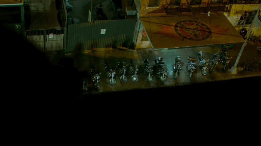 Aerial view of motorcycles parked outside Dogs of Hell bar.