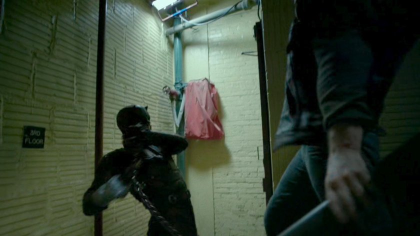 Daredevil fighting Dogs of Hell gang members in stairway.