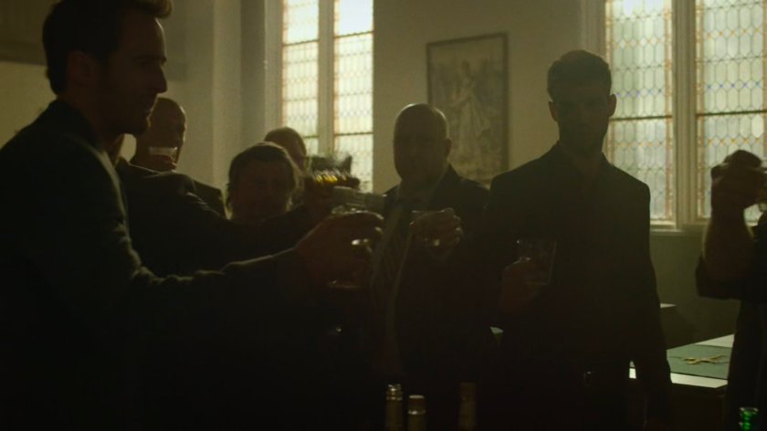 Members of the Kitchen Irish toast their dead friends in a church.