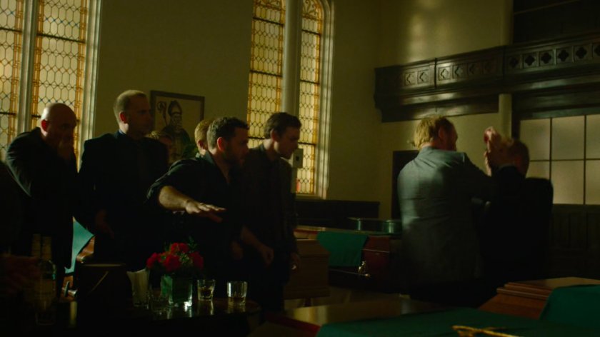 Finn attacks a member of the Kitchen Irish in a church.