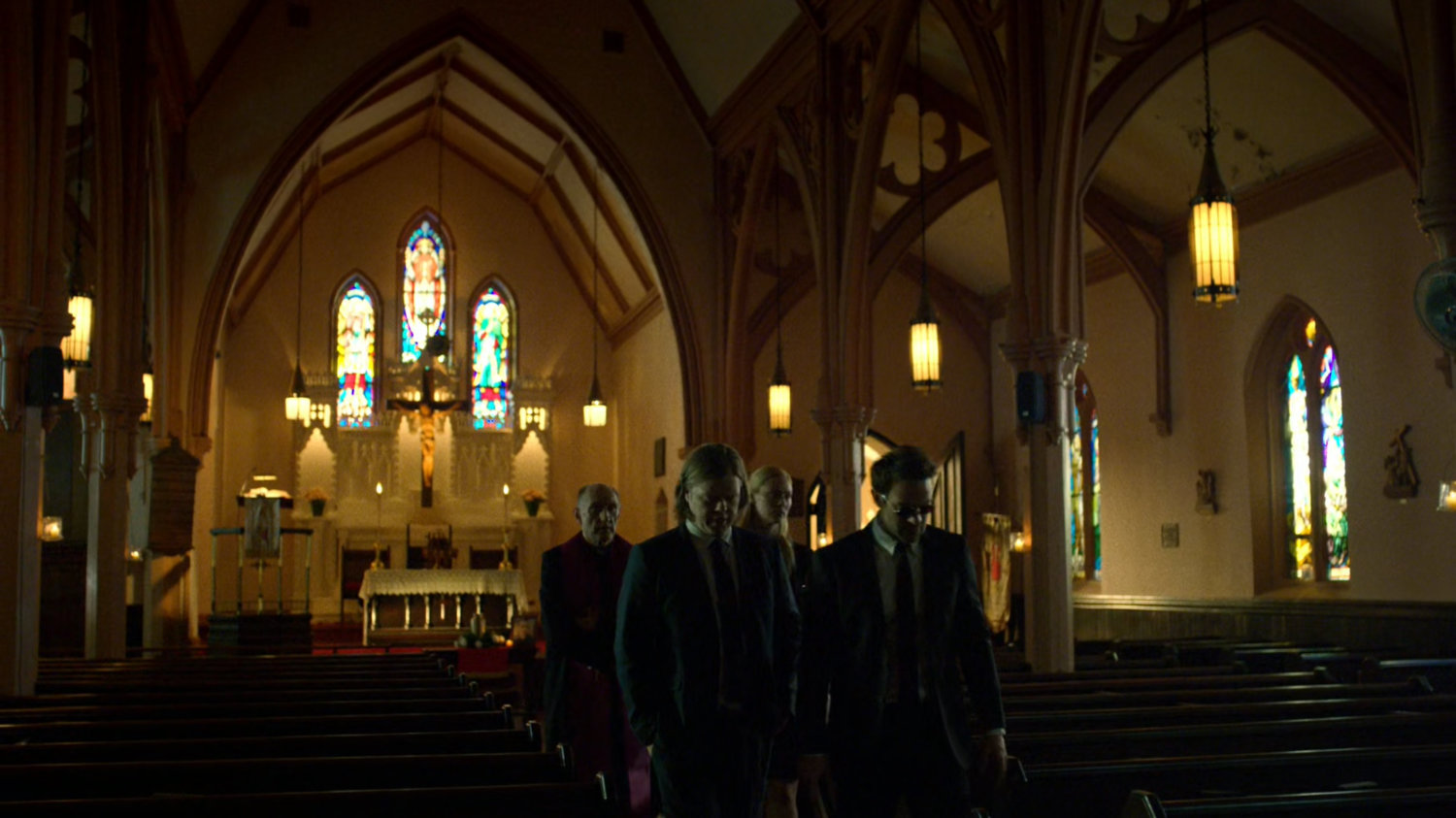 Father Lantom, Matt, Karen, and Foggy walking through church.