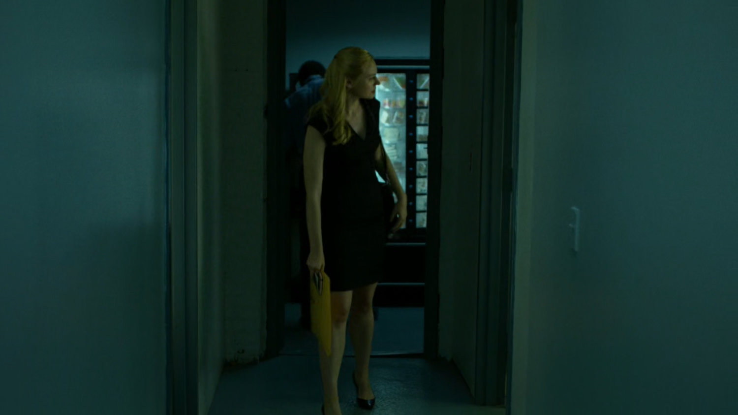 Karen walks through office building looking for George Bach.