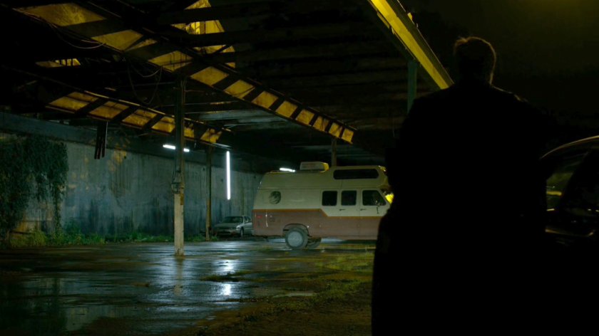 Men approaching Frank Castle's camper.