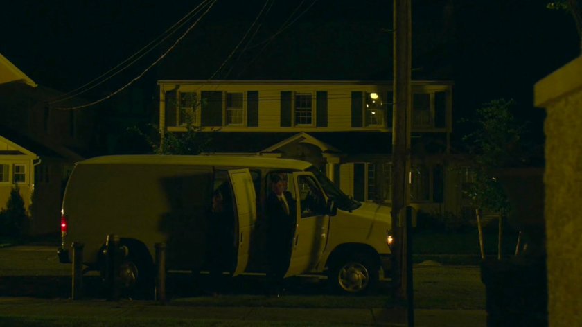 People getting out of white van outside Frank Castle's house.