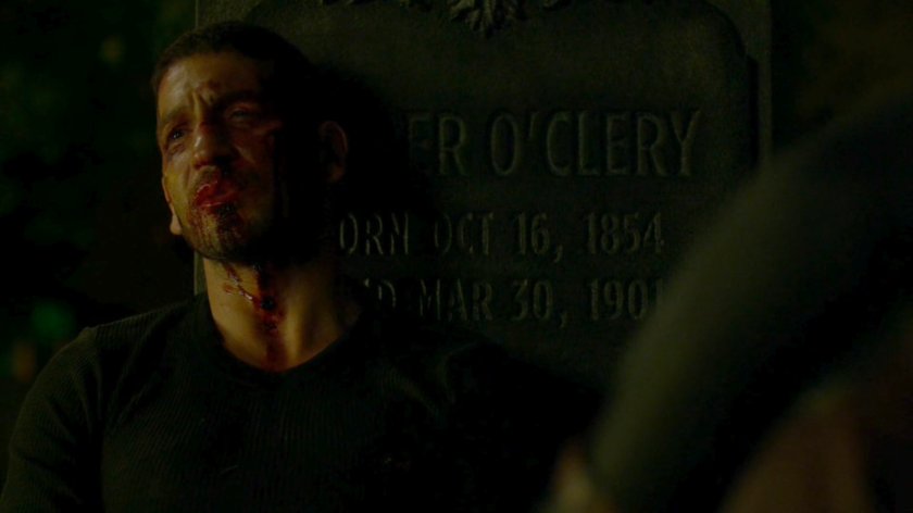 Frank leaning against a tombstone in St. Michael's Cemetery.