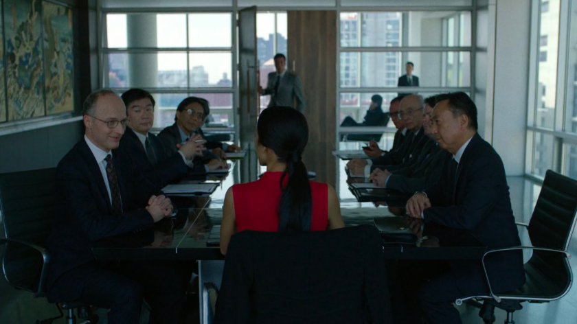 Elektra and Roxxon board members at a table in the conference room of the Yakatomi Building.
