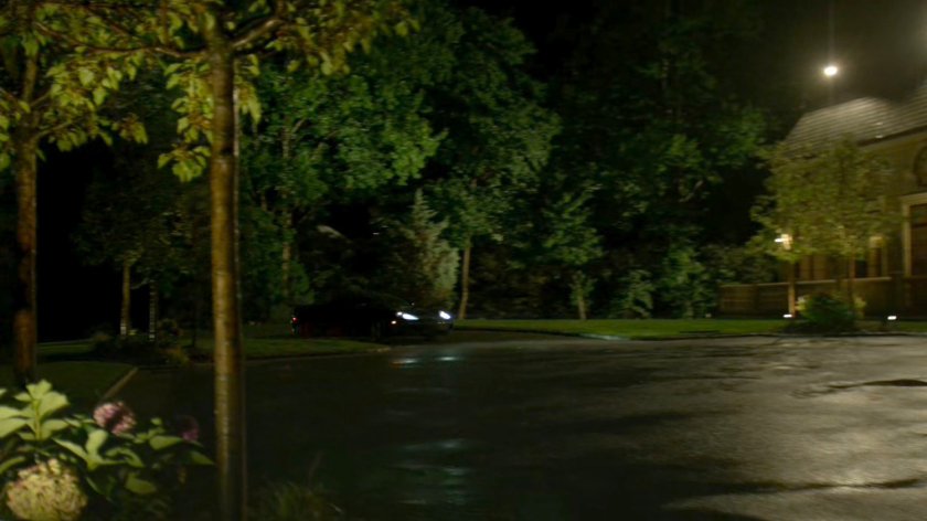 A car drives up to Roscoe Sweeney's mansion.