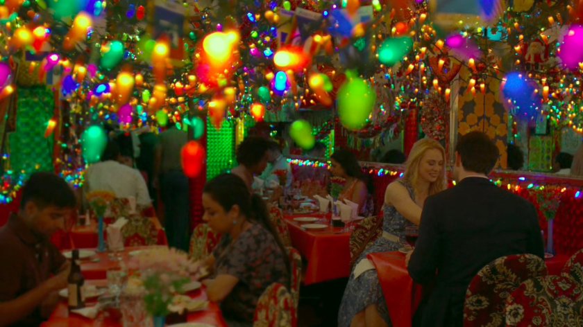 Matt and Karen in an Indian restaurant covered in small lights.