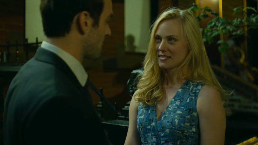 Matt and Karen standing on sidewalk outside her apartment.