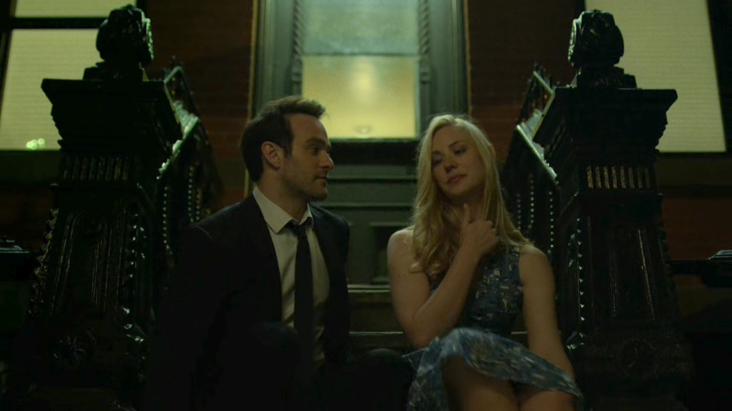 Matt and Karen sitting on steps outside her apartment.