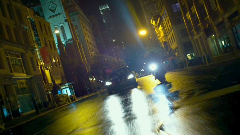 A Yakuza motorcycle rider cruises through a New York street.