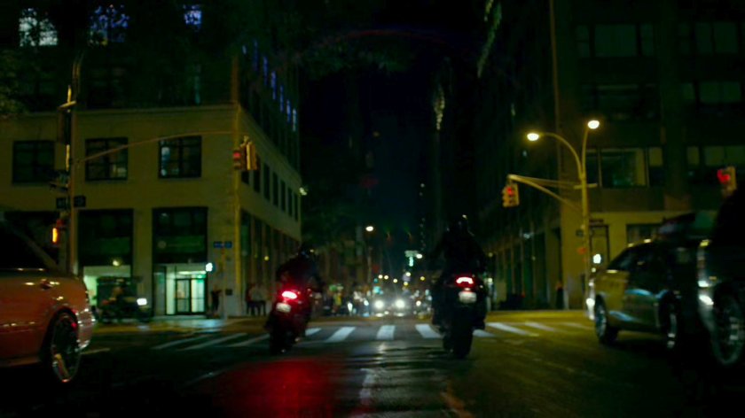 A pair of Yakuza motorcycle riders cruise through a New York street.