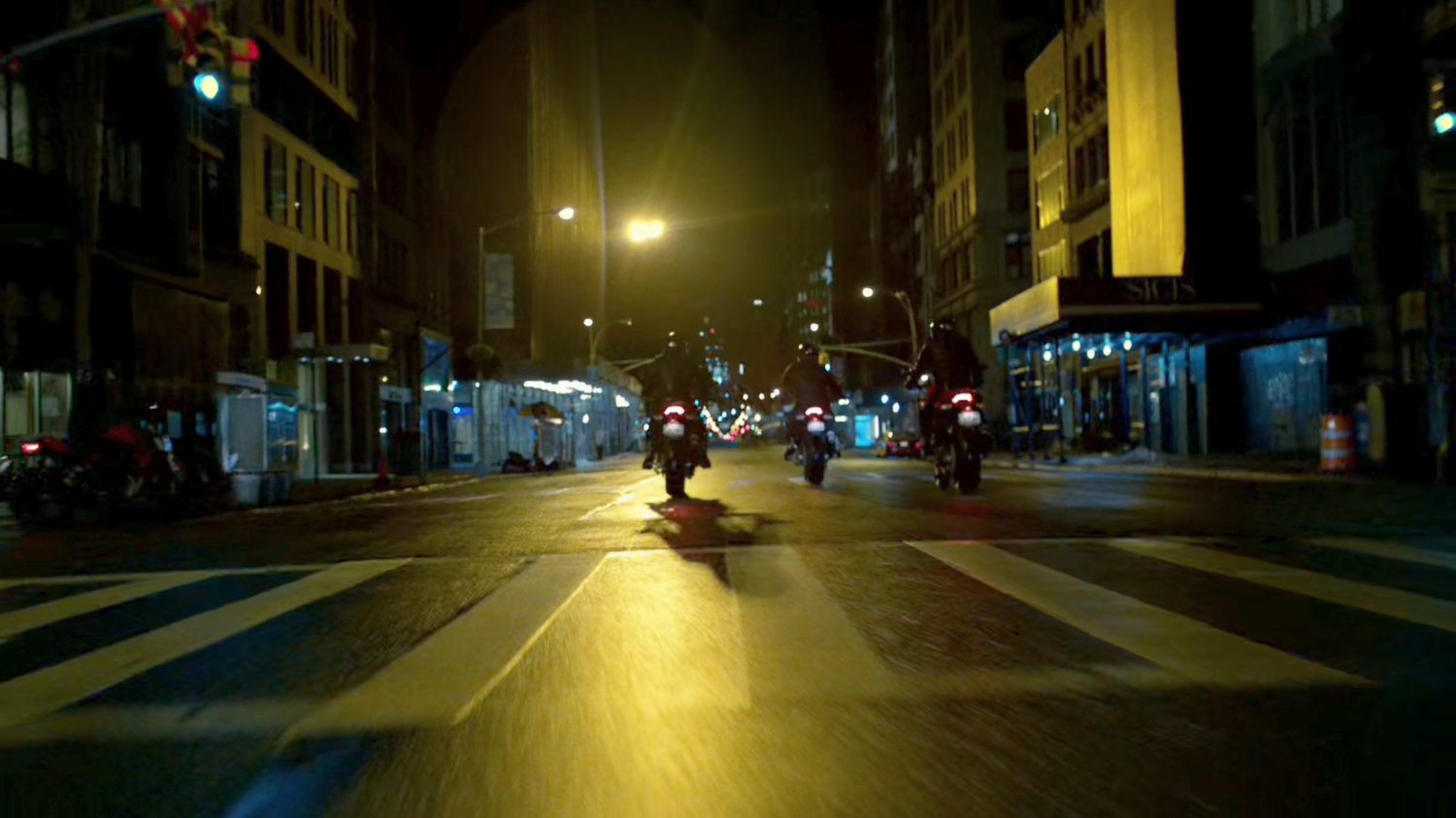 A trio of Yakuza motorcycle riders cruise through a New York street.