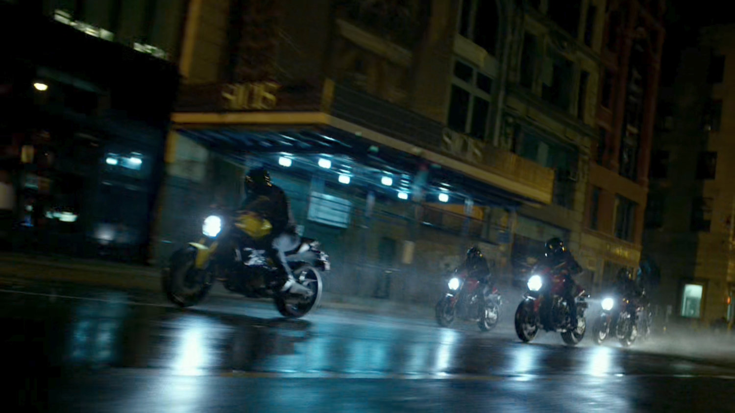 A group of Yakuza motorcycle riders cruise through a New York street.