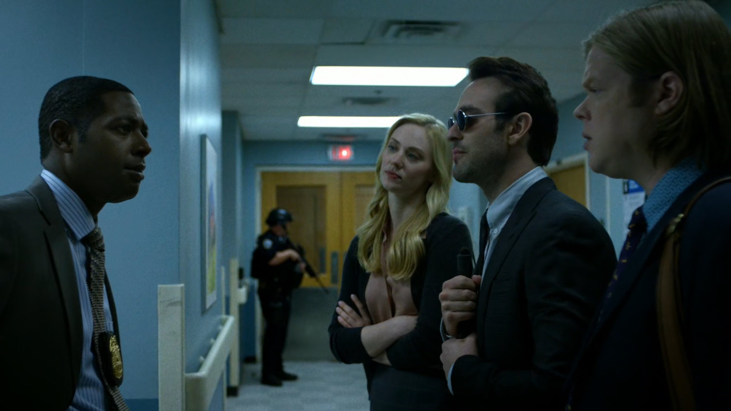Karen, Matt, and Foggy talk to Detective Mahoney on the 5th floor of Metro-General Hospital.