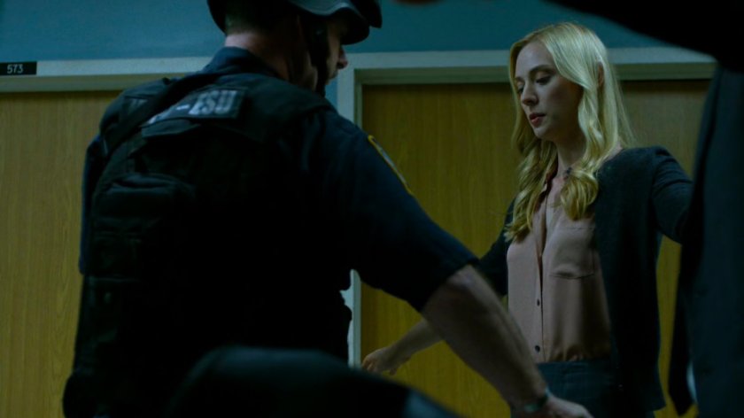 Karen goes through a security sweep outside Frank Castle's Metro-General Hospital room.