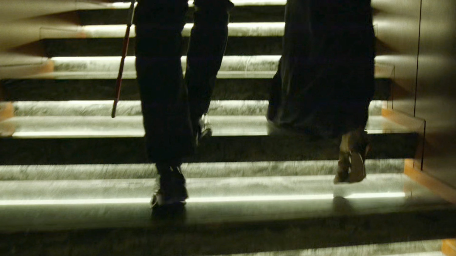 Matt and Elektra ascend stairs at the Roxxon Gala.