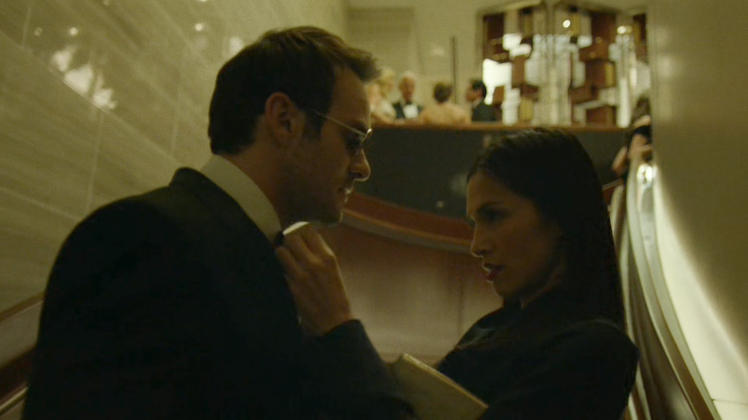 Elektra fixing Matt's tie at the Roxxon Gala.
