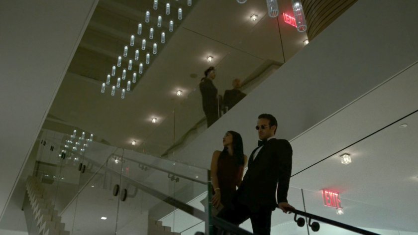 Matt and Elektra on stairs on the 13th floor of the Yakatomi Building.