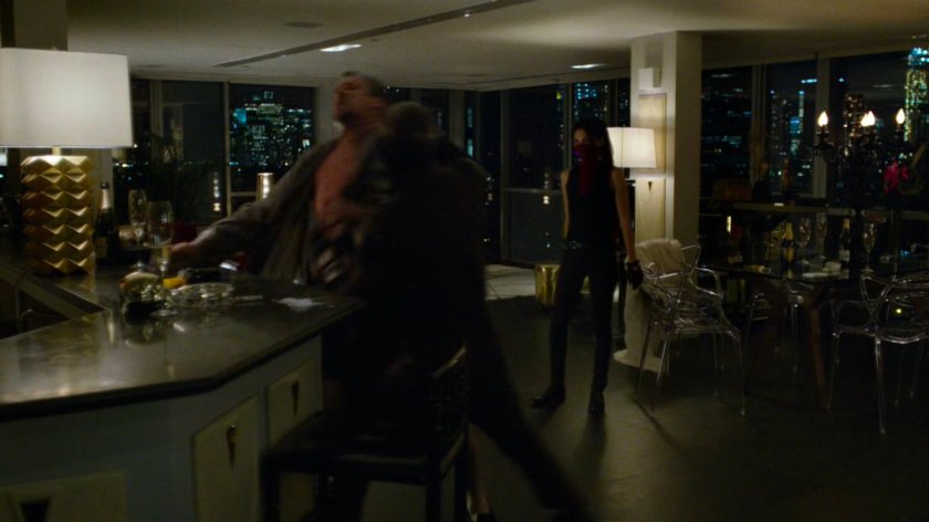Daredevil attacks Philip Cabroni as Elektra watches.