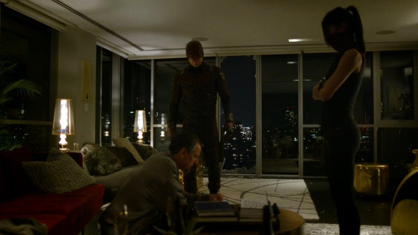 Daredevil and Elektra in Philip Cabroni's apartment.
