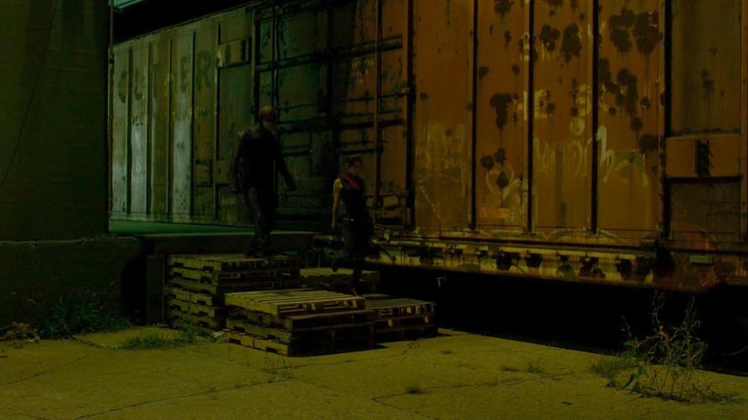Daredevil and Elektra investigate the Bay Ridge Rail Yard.