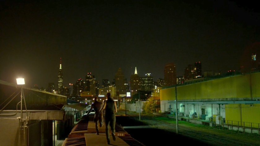 Daredevil and Elektra run along train top at the Bay Ridge Rail Yard.