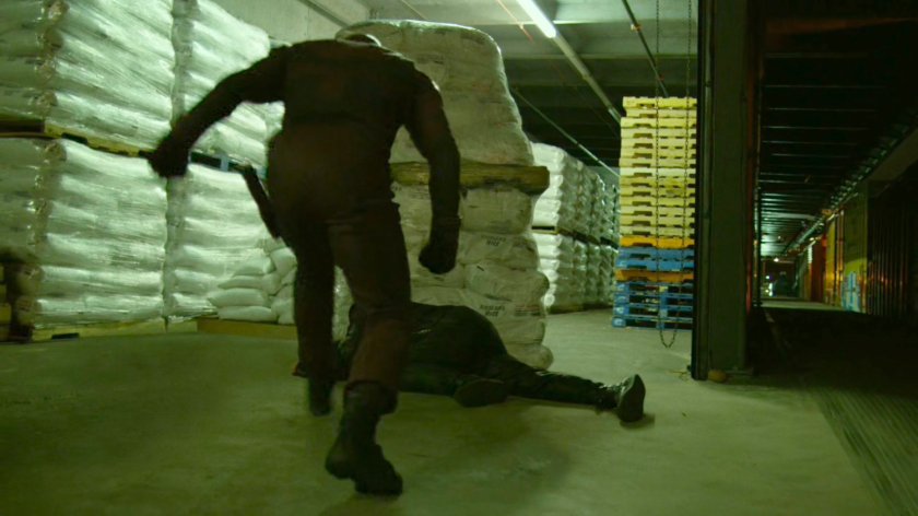 Daredevil fights Yakuza member in warehouse at the Bay Ridge Rail Yard.