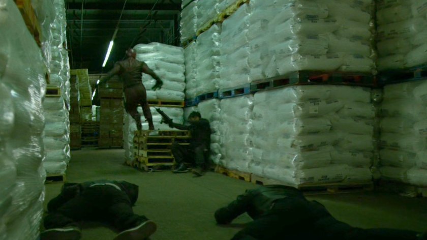 Daredevil fights Yakuza member in warehouse at the Bay Ridge Rail Yard.