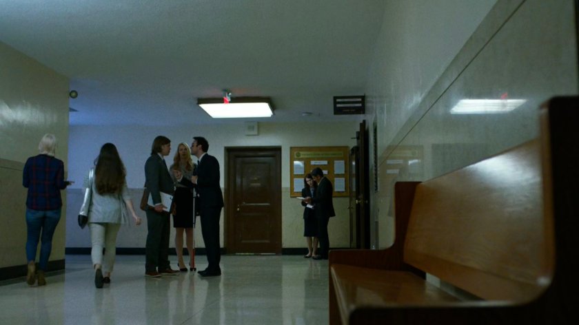 Foggy, Karen, and Matt argue in courthouse hallway.