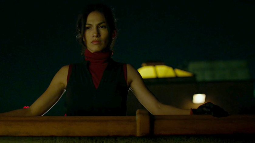 Elektra watching from a rooftop.