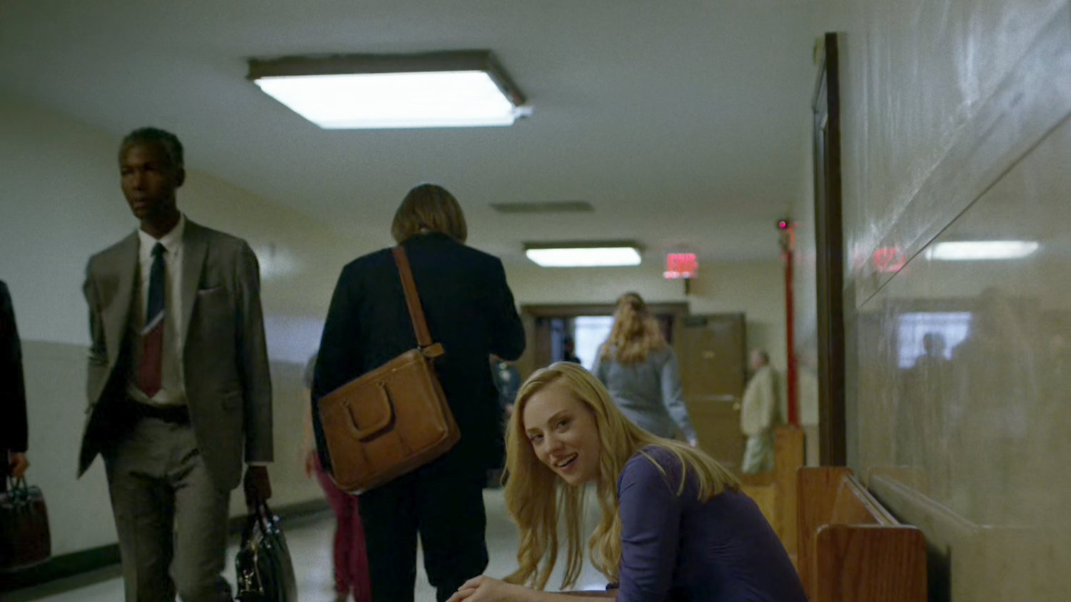 Foggy and Karen in courthouse hallway.