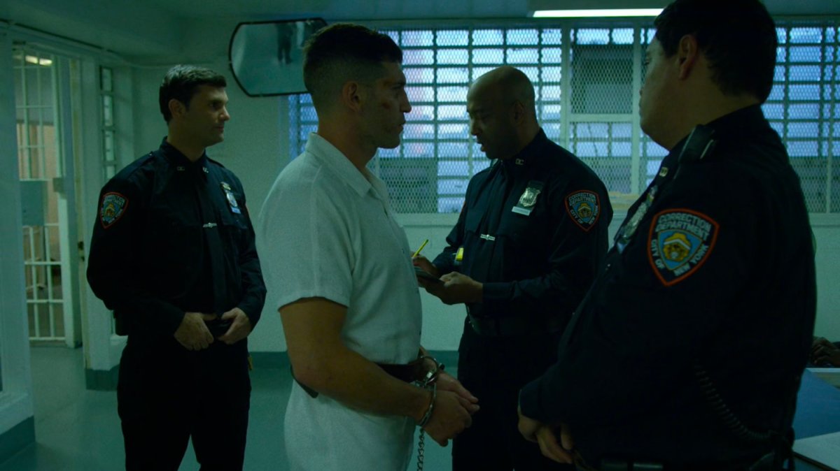 Frank Castle in getting checked into Ryker's Island correctional facility.