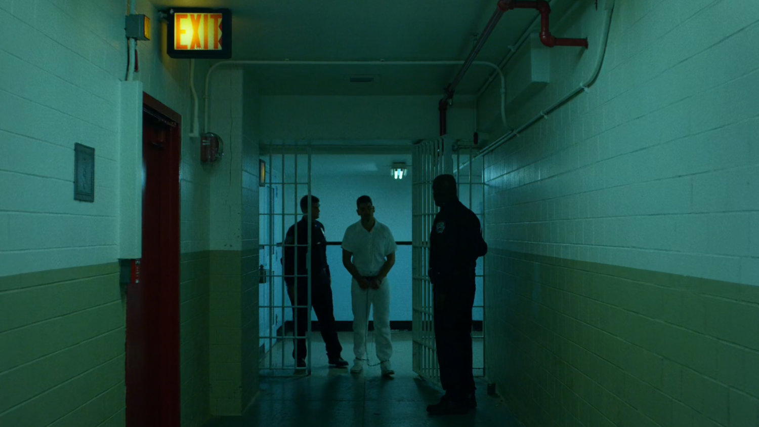 Frank escorted through gate at Ryker's Island correctional facility.
